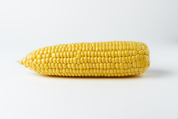 Cob of corn on white background. Food creative concept.