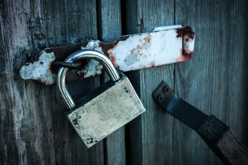 Padlock on the doors of the old barn