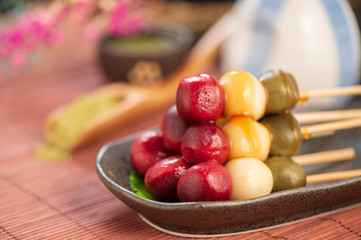 Japanese Dango dessert with 3 different color in pink(red), white, and green, recipe, hanami Dango, tsukimi Dango, copy space.
