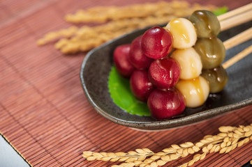 Japanese Dango dessert with 3 different color in pink(red), white, and green, recipe, hanami Dango, tsukimi Dango, copy space.
