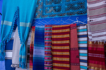 Souvenirs stall in a street of Chefchaouen, famous blue village of Morocco