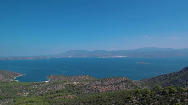 Aerial footage of a mountain in Argolis Greece. View of the Saronic gulf. Reveal shot.