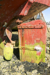 Propeller of abandoned boat in ship graveyard.