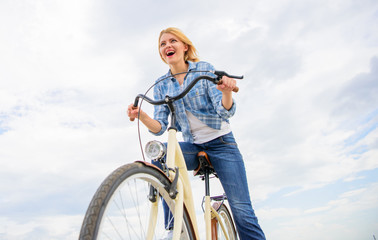 Leisure cycling is about seeing exploring and visiting new places on bicycle. Girl enjoy short cycle tour with stop offs along way and travel. Woman likes to ride bike fast. Lady emotional bike rider