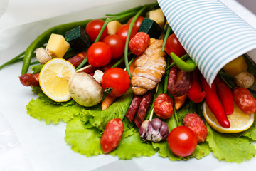 A set of vegetables, sausages and cheese. The original bouquet.
