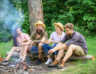 Best friends spend leisure weekend hike barbecue forest nature background. Company friends picnic or barbecue near bonfire. Roasting marshmallows barbecue. Friends enjoy weekend barbecue in forest