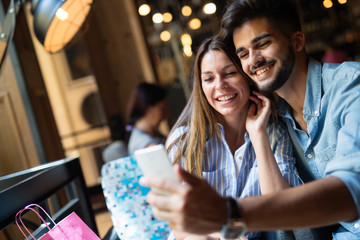 Young attractive couple on date in coffee shop