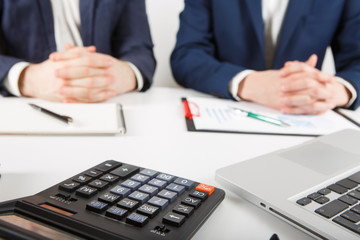 Business people discussing the charts and graphs showing