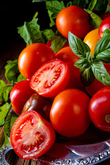 various types of tomatoes served and presented on the silver platter.