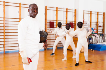 African american man fencer in training room