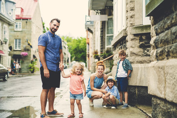 happy family with childs in city.