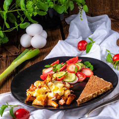 fresh chanterelles with scrambled eggs and a green salad