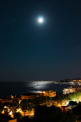 Fototapeta premium Moon in a dark night, Menton, France.