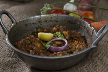 Indian chicken roast in iron pan