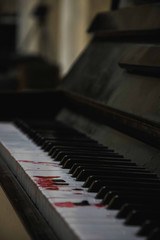 A piano with red markings on the keys.