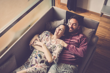 Laugha and smile for cheerful people. love and relationship concept for caucasian man and woman lay...