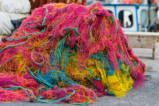 Colorful fishnet in a boat in the port Heraklion on the dusk. Island of Crete, Greece