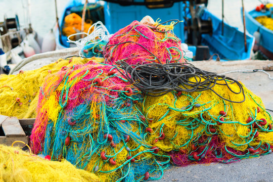 Colorful fishnet in a boat in the port Heraklion on the dusk. Island of Crete, Greece
