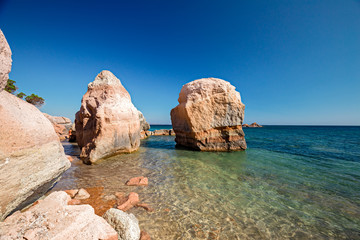 Rock formations of the cliffs and beaches of the island of San Pietro in Sardinia, Italy.
