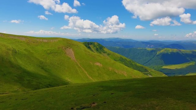 Aerial shot of two mountains with flat peaks in the Carpathians in summer