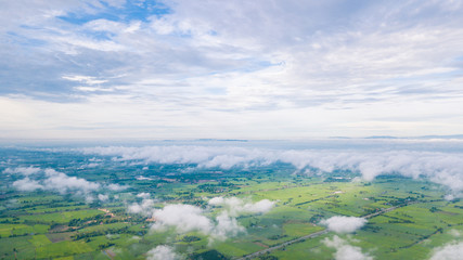 Aerial view of Cloudy sky high above the earth © nipastock