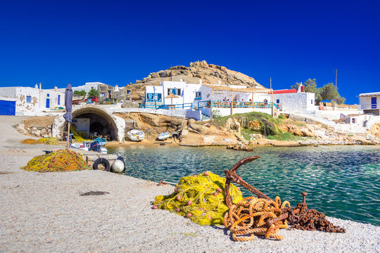 Beautiful small village at Kalafati beach with octopus drying in the sun, Mykonos island, Greece.