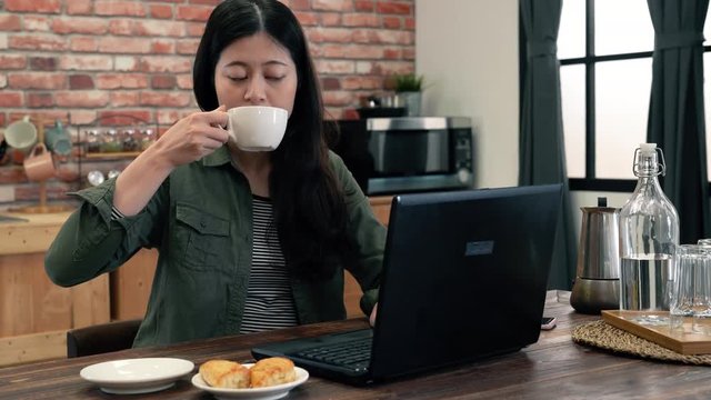 Woman using computer joyful.