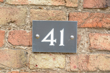 House number 41 sign on wall