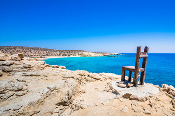 The tropical beach of Tripiti at the southern point of Gavdos island and Europe too, with the famous giant wooden chair, Greece.