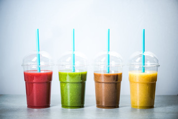 Healthy diet smoothie in four colors