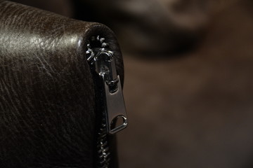 Brown Leather Upholstery and zipper of  Sofa