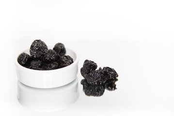 Bowl of prunes isolated