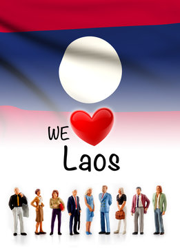 we love Laos, A group of people pose next to the Laotian flag
