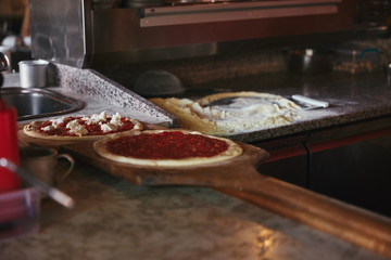 pizza ingredients on table  at restaurant kitchen
