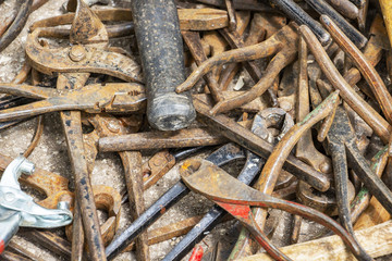 Disorderly scattered various pliers, hand tool texture background