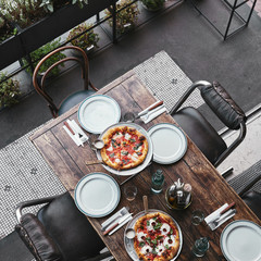 top view of different delicious pizza on trays at restaurant