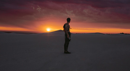 Athlete looking at desert sunset © Jacob Lund