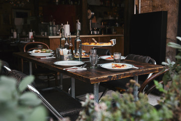 delicious italian meal on rustic table at modern restaurant