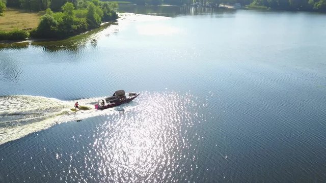Motor boat pulls a wakeboarder