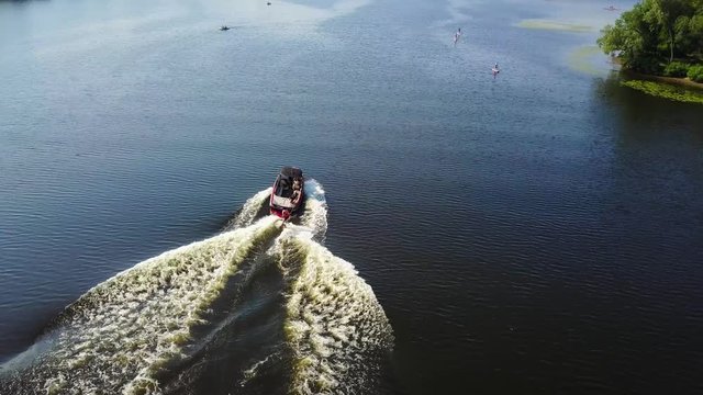 Motor boat pulls a wakeboarder