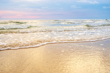 Fototapeta na wymiar sand beach with wave bubble ripple
