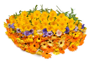 Bouquet is beautiful oval form with flowers of calendula, koreopsis and cornflowers. Yellow, orange and blue. Creative arrangement. Useful and medicinal herbs. Flat lay, top view
