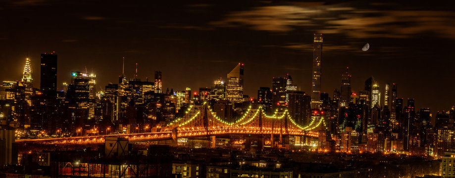 Queensboro Bridge Seen At Night With The Moon Overhead