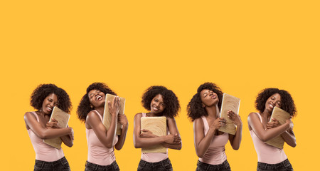 Businesswoman with laptop. Love to computer concept. Attractive female half-length front portrait, trendy yellow backgroud. Young afro emotional woman. Human emotions, facial expression concept.