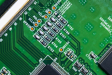 Macro shot of a Circuitboard with resistors microchips and electronic components. Computer hardware technology. Integrated communication processor. Information engineering. Semiconductor. PCB. Closeup