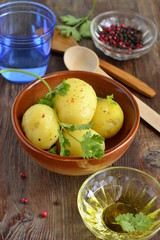 Young boiled potatoes with cilantro, vertical