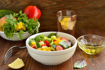 Salad with sweet corn, cucumber, sweet pepper and peach with ingredients
