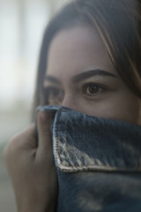 Сovered face with a denim jacket