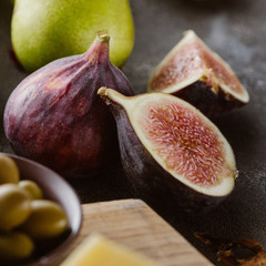close up view of fresh figs arranged on tabletop
