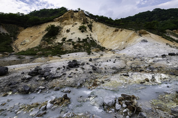 Mountain of hot spring with hot water stream